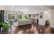 Open-concept living space featuring hardwood floors, abundant natural light, and backyard views at 3766 E Ringtail Way, Phoenix, AZ 85050