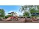 Community playground with slides and climbing structures offers outdoor fun and recreation for children at 3766 E Ringtail Way, Phoenix, AZ 85050