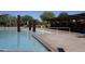 Inviting community pool with shade structures and lush desert landscaping, a perfect oasis at 3766 E Ringtail Way, Phoenix, AZ 85050