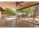 Charming backyard featuring tiled patio, lush greenery, and mature trees, creating a serene outdoor space at 38 E Calavar Rd, Phoenix, AZ 85022