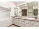 Bathroom vanity featuring dual sinks, ample counter space, and stylish fixtures, blending functionality and design at 38 E Calavar Rd, Phoenix, AZ 85022