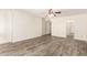 Bedroom with a ceiling fan and wood-look floors, offering a serene and comfortable living space at 38 E Calavar Rd, Phoenix, AZ 85022