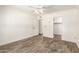 Light-filled bedroom with wood-look floors, ceiling fan and ample closet space, perfect for relaxation at 38 E Calavar Rd, Phoenix, AZ 85022