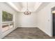 Dining room with a chandelier and a large window at 38 E Calavar Rd, Phoenix, AZ 85022