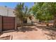 Exterior showcasing a cozy patio with brick accents, trees, and privacy features at 38 E Calavar Rd, Phoenix, AZ 85022