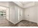 An elegant foyer with a front door with window, access to multiple rooms and attractive flooring at 38 E Calavar Rd, Phoenix, AZ 85022
