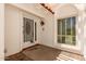 An inviting white front door with a security screen and a window, protected by a white archway at 38 E Calavar Rd, Phoenix, AZ 85022