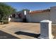 Charming single-story home with white exterior, barrel tile roof, and easy to maintain landscaping at 38 E Calavar Rd, Phoenix, AZ 85022