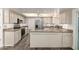 Bright, updated kitchen with stainless steel appliances and neutral countertops at 38 E Calavar Rd, Phoenix, AZ 85022