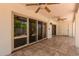 Inviting covered patio with ceiling fans, offering a shaded retreat for enjoying the outdoor view at 38 E Calavar Rd, Phoenix, AZ 85022