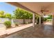 Relaxing covered patio with tiled flooring, perfect for outdoor dining and leisure at 38 E Calavar Rd, Phoenix, AZ 85022