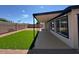 Well-kept backyard with artificial grass and covered patio at 3910 W Kings Ave, Phoenix, AZ 85053