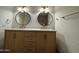Bathroom featuring a double sink vanity with marble countertop and modern fixtures at 3910 W Kings Ave, Phoenix, AZ 85053