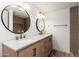 Bathroom features dual sinks, modern fixtures, and stylish tile at 3910 W Kings Ave, Phoenix, AZ 85053