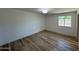 Bedroom featuring wood-look flooring and natural light from the window at 3910 W Kings Ave, Phoenix, AZ 85053