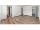 This neutral bedroom features hardwood floors with access to an ensuite bathroom at 3910 W Kings Ave, Phoenix, AZ 85053