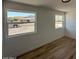 Bedroom featuring wood-look flooring and natural light from the windows at 3910 W Kings Ave, Phoenix, AZ 85053