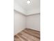 Spacious closet with a wood-look floor and custom shelving for optimal storage at 3910 W Kings Ave, Phoenix, AZ 85053