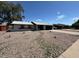 Single-story home with xeriscaped front yard, and a covered front porch at 3910 W Kings Ave, Phoenix, AZ 85053