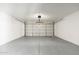 Two car garage with an automatic door and sealed concrete flooring at 3910 W Kings Ave, Phoenix, AZ 85053