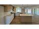Bright kitchen with island, pendant lights, and modern appliances at 3910 W Kings Ave, Phoenix, AZ 85053