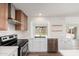 Well-equipped kitchen featuring stainless steel appliances, custom cabinets, and an open layout at 3910 W Kings Ave, Phoenix, AZ 85053