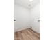 Functional laundry room with connections for washer and dryer and neutral wood-look flooring at 3910 W Kings Ave, Phoenix, AZ 85053