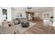 Comfortable living room showcases a ceiling fan and transitions into a modern kitchen at 3910 W Kings Ave, Phoenix, AZ 85053