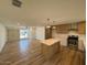 Open floor plan of living room and kitchen with natural light at 3910 W Kings Ave, Phoenix, AZ 85053