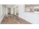 Bright living room features hardwood floors and an open floor plan into the kitchen at 3910 W Kings Ave, Phoenix, AZ 85053