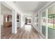 Spacious living room features hardwood floors and an open layout to kitchen and backyard at 3910 W Kings Ave, Phoenix, AZ 85053