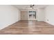 Inviting living room features natural light, wood-look flooring, and ample space at 3910 W Kings Ave, Phoenix, AZ 85053