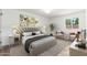 Inviting main bedroom boasts modern decor and an abundance of natural light at 3910 W Kings Ave, Phoenix, AZ 85053