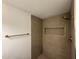 Modern shower featuring decorative tile, built-in niche, and brass fixtures at 3910 W Kings Ave, Phoenix, AZ 85053