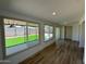 Bright sun room with multiple windows overlooking backyard at 3910 W Kings Ave, Phoenix, AZ 85053