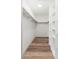 Walk-in closet with hardwood floors and custom shelving for optimal organization and storage at 3910 W Kings Ave, Phoenix, AZ 85053