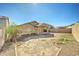 Spacious backyard featuring desert landscaping, a covered patio, and ample space for outdoor activities at 4050 E Agave Rd, Phoenix, AZ 85044