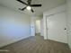 Bedroom featuring a neutral carpet, closet with sliding doors, and ceiling fan with light at 4050 E Agave Rd, Phoenix, AZ 85044