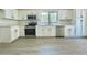 Modern kitchen featuring white cabinets, stainless steel appliances, and ample counter space at 4050 E Agave Rd, Phoenix, AZ 85044
