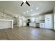Open kitchen area showcases white cabinetry, stainless steel appliances, and an adjacent dining space at 4050 E Agave Rd, Phoenix, AZ 85044