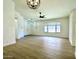 Spacious living room boasting modern lighting, neutral paint, and stylish vinyl plank flooring throughout at 4050 E Agave Rd, Phoenix, AZ 85044