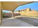 Covered patio view showcasing backyard and block fence, ideal for relaxation and entertaining at 4050 E Agave Rd, Phoenix, AZ 85044