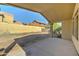 Covered patio view showcasing backyard and block fence, offering a serene outdoor living space at 4050 E Agave Rd, Phoenix, AZ 85044