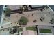 Aerial view showing yards with turf, desert, and landscaping at 41041 W Somers Dr, Maricopa, AZ 85138