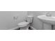 Bathroom featuring neutral paint, tile flooring, and a pedestal sink at 41041 W Somers Dr, Maricopa, AZ 85138