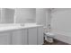Bright bathroom featuring modern vanity, white countertop, and full tub-shower combo with tiled walls at 41041 W Somers Dr, Maricopa, AZ 85138