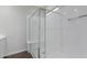 Bright shower with glass doors and white tile at 41041 W Somers Dr, Maricopa, AZ 85138