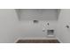 White utility room featuring vinyl floors and hookups for a washer and dryer at 41041 W Somers Dr, Maricopa, AZ 85138
