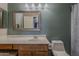 Bathroom with single sink vanity, framed mirror, and shower with curtain at 450 N 110Th St, Mesa, AZ 85207