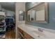 Bathroom with vanity, mirror, and walk-in closet at 450 N 110Th St, Mesa, AZ 85207